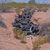 Earth fissure as a dumping ground for tires.