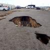 Fissure pot holes in parking lot near Apache Junction, Pinal County, AZ (7/2017)